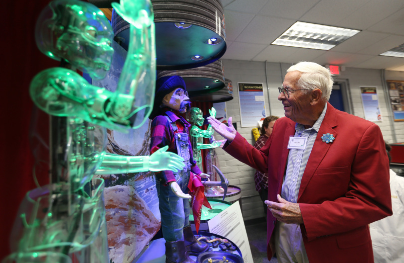 Disney Imagineer Bob Gurr interacting with animatronics in Garner Holt Education Through Imagination Animakerspace